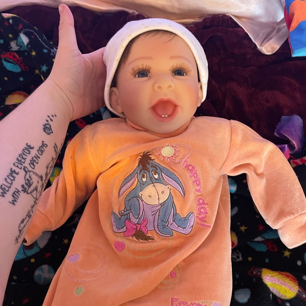 Reborn doll with cloth body, selling all his clothes that fit him as well.